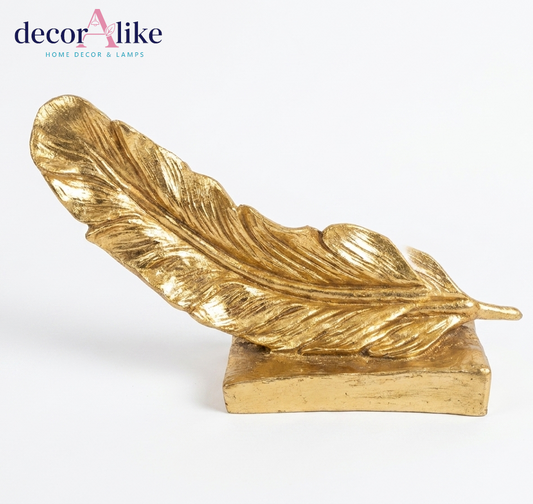 Reclining gold feather sculpture on block base – Decoralike Lahore