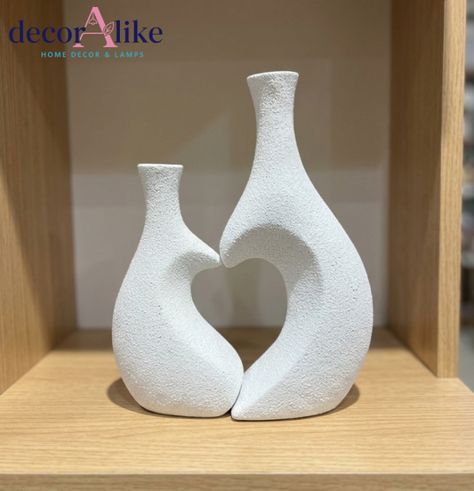 Set of two white heart-shaped decorative vases with dried pampas grass