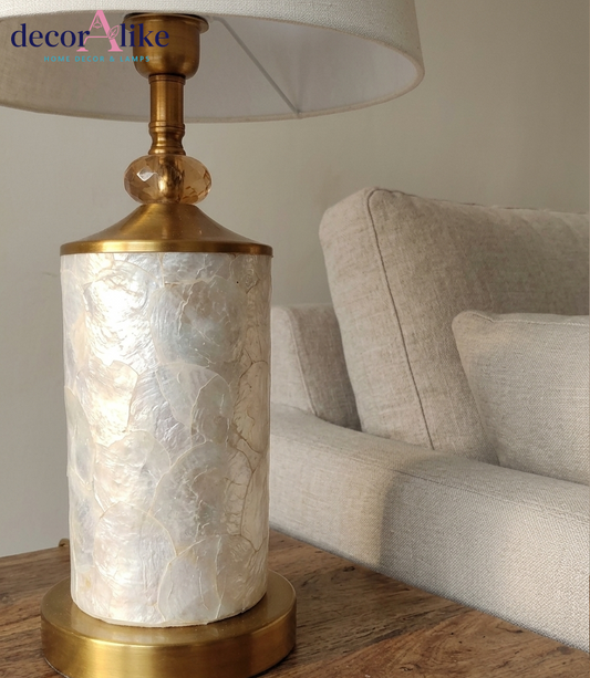 Capiz shell table lamp with gold fittings and crystal bead detail on wooden table — cream bedside lamp Pakistan