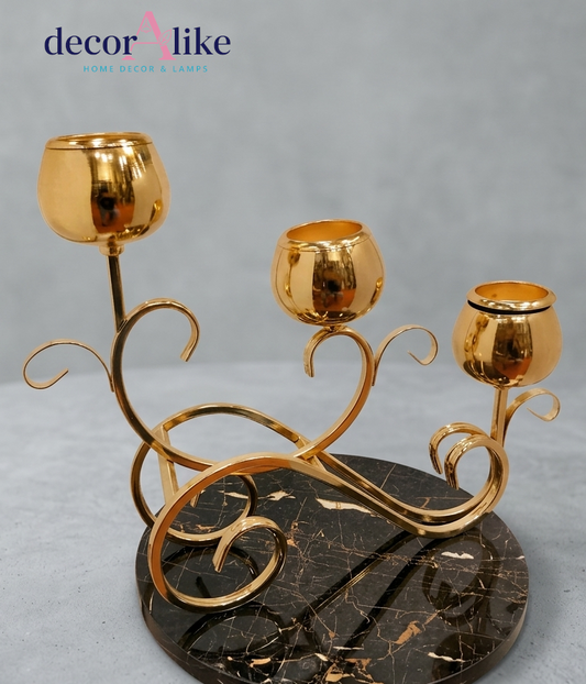Gold scroll tealight candle holder with three cups on black marble base