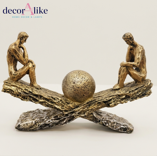 Balance thinker sculpture with two figures on crossed beams – Decoralike Lahore