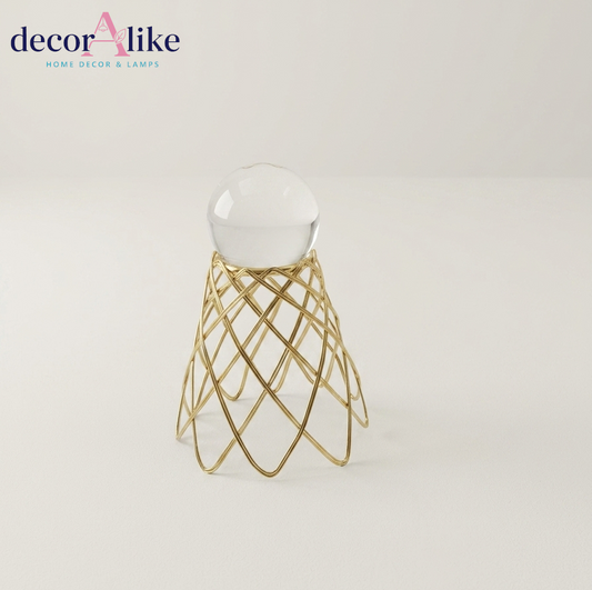 Glass orb on gold wire cage stand – modern tabletop decor – Decoralike Lahore