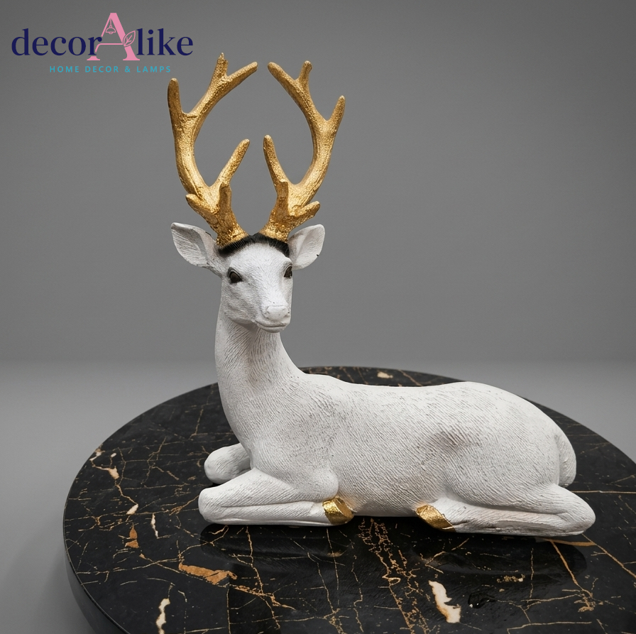 White resting deer figurine with gold antlers – Decoralike Lahore