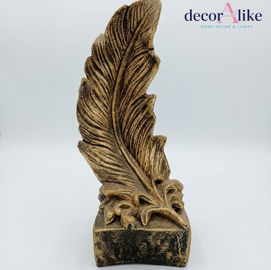 Antique gold textured feather sculpture on plinth base – Decoralike Lahore