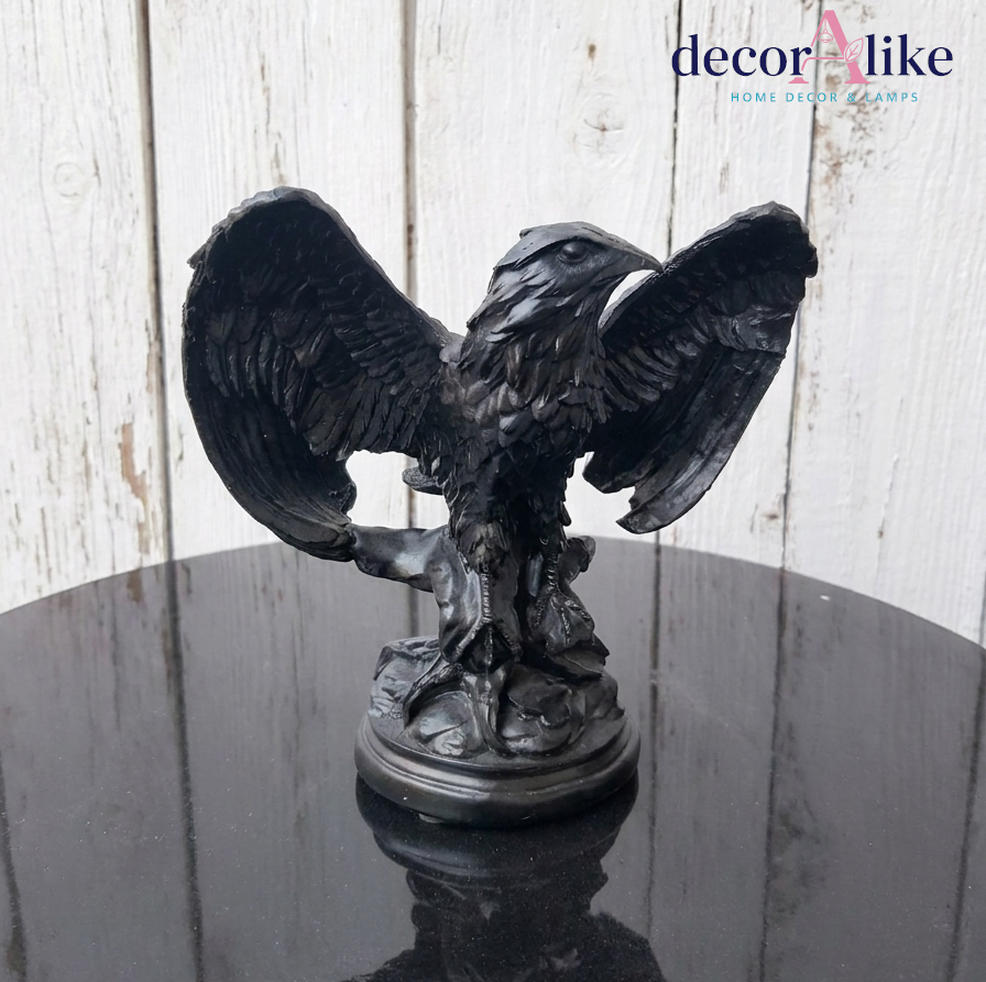 Matte black eagle sculpture on round pedestal base – Decoralike Lahore