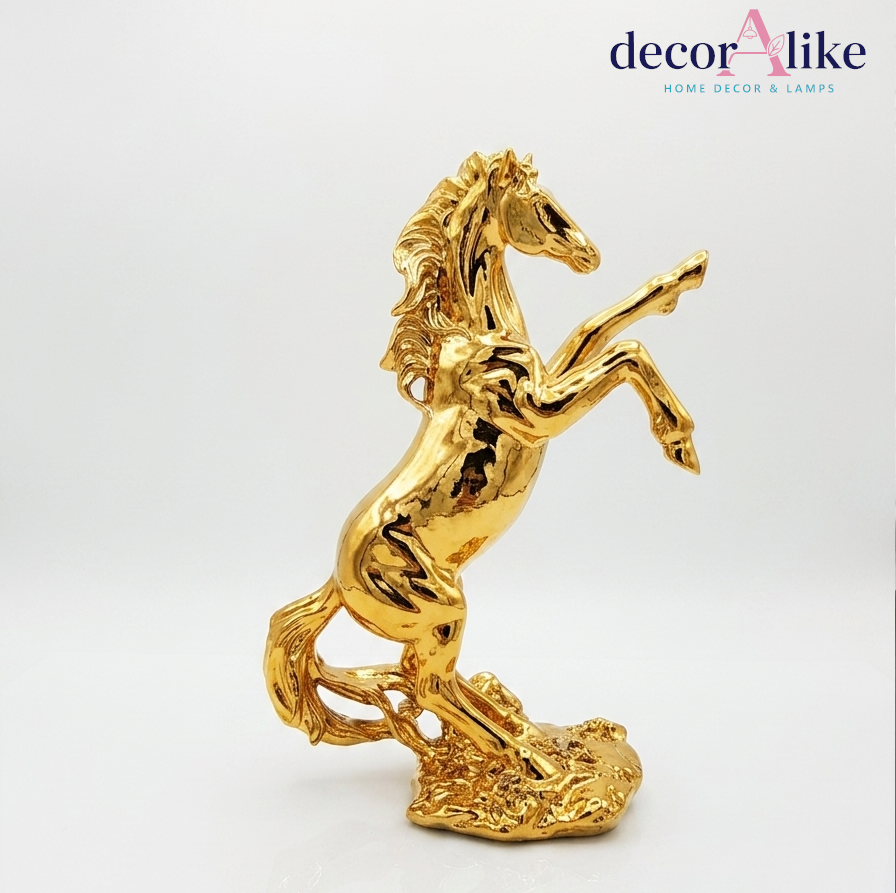 Luxury high-shine golden rearing horse statue by DecorAlike, a premium abstract equestrian decoration piece for living room tables in Pakistan.