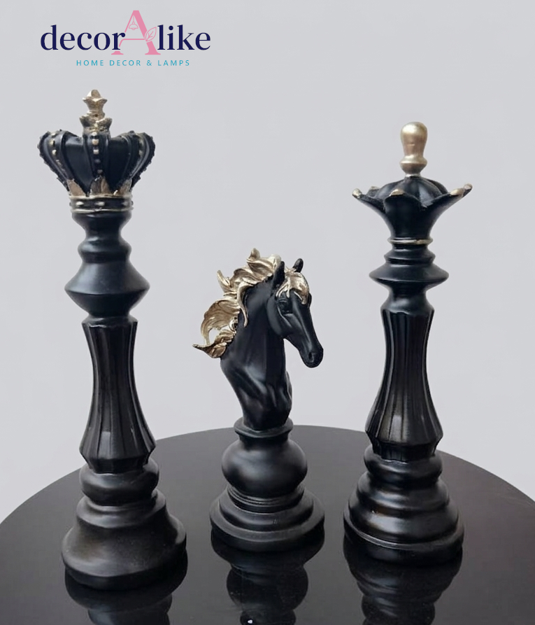 Three decorative chess-piece-style lamps on a glossy black surface against a light gray background, with the brand name 'decorAlike' shown in the top left corner.
