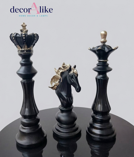 Three decorative chess-piece-style lamps on a glossy black surface against a light gray background, with the brand name 'decorAlike' shown in the top left corner.