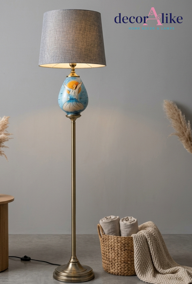 Hand-painted whirling dervish floor lamp with brass pole and pleated grey shade in a living room corner