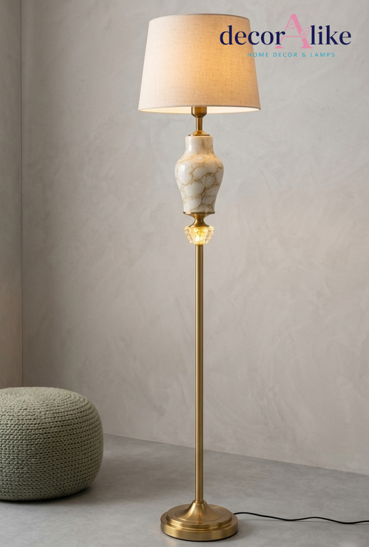 Marble effect ceramic floor lamp with gold brass column and ivory linen shade