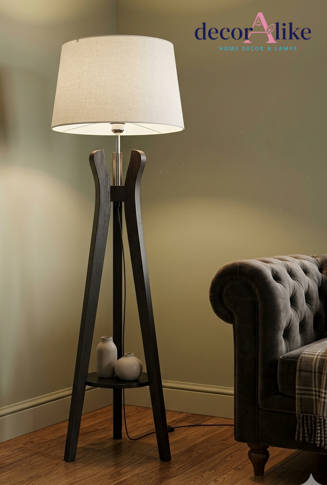 Dark wood curved tripod floor lamp with cream linen shade and display shelf