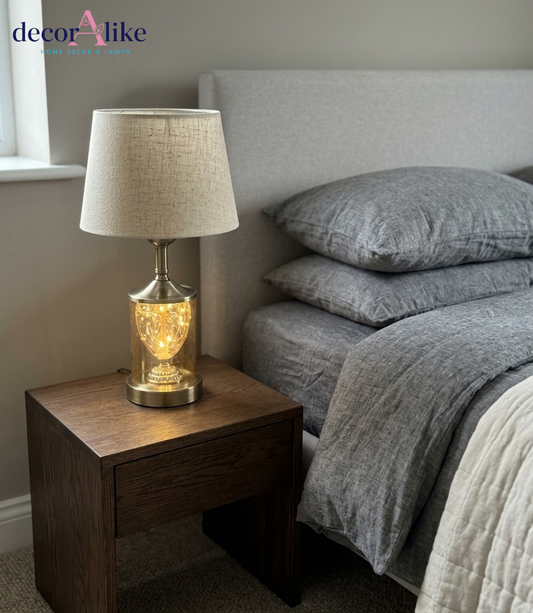 DecorAlike luxury fairy lights glass cloche table lamp showing brass details and linen drum shade