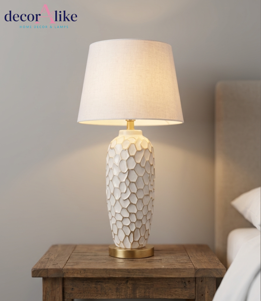 Tall white ceramic table lamp with carved honeycomb texture and gold base — statement living room lamp Pakistan