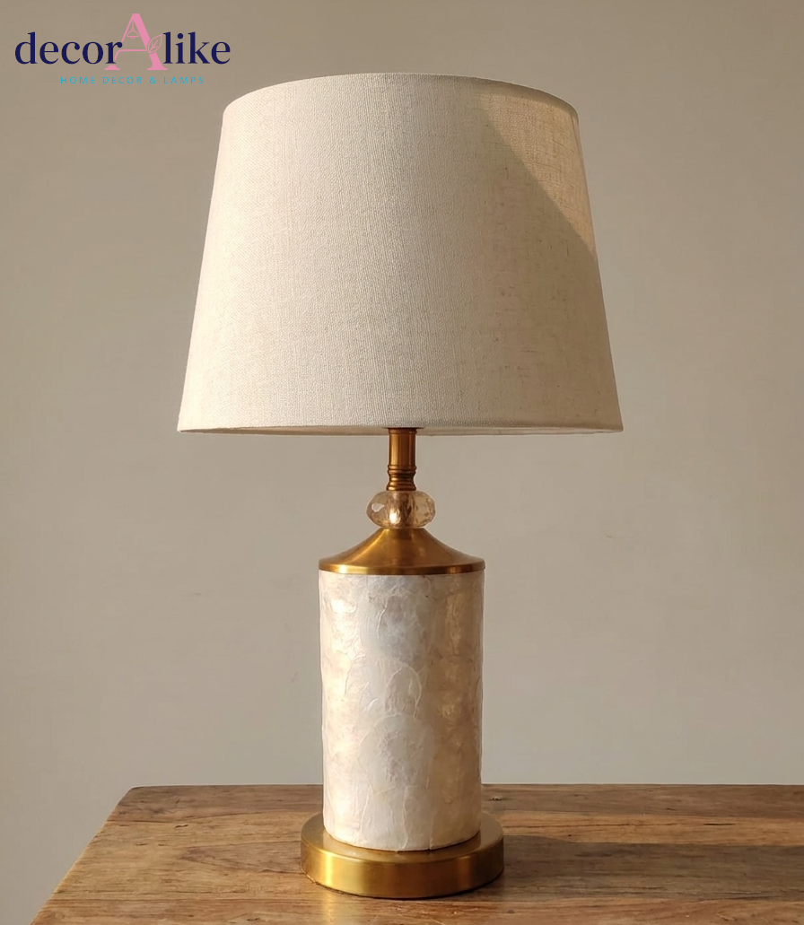 Capiz shell table lamp with gold fittings and crystal bead detail on wooden table — cream bedside lamp Pakistan