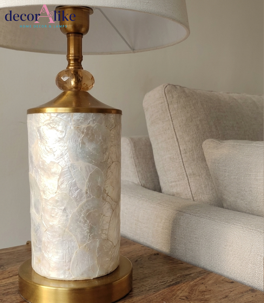 Capiz shell table lamp with gold fittings and crystal bead detail on wooden table — cream bedside lamp Pakistan