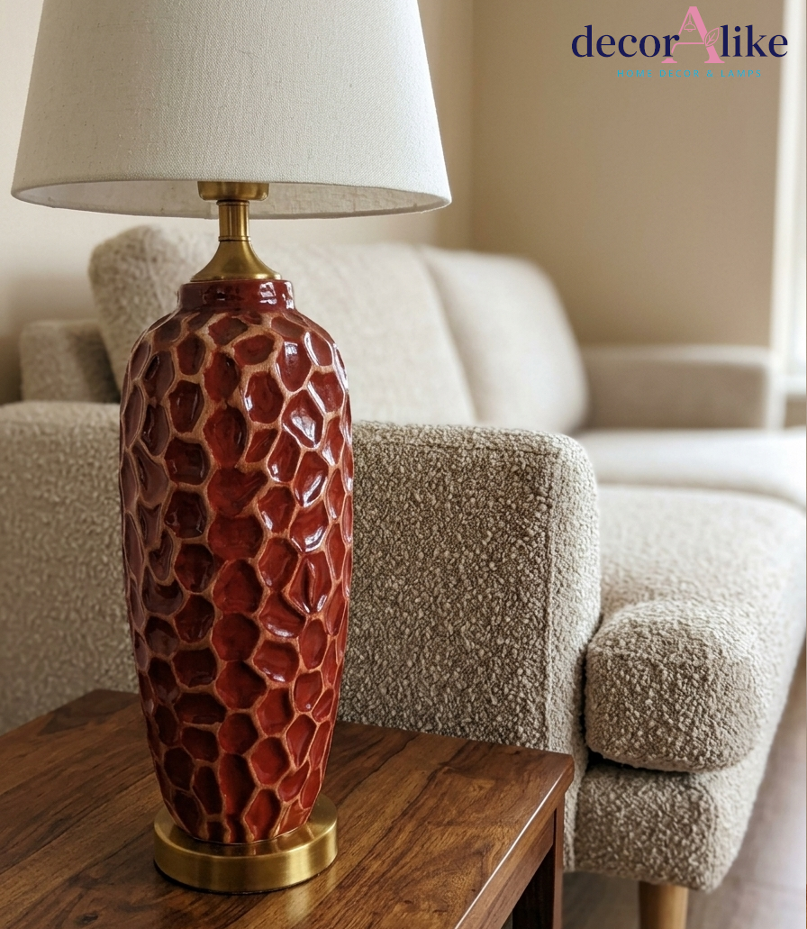 Tall red ceramic table lamp with carved honeycomb texture and gold base — statement living room lamp Pakistan