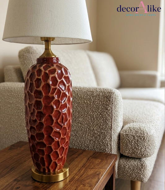 Tall red ceramic table lamp with carved honeycomb texture and gold base — statement living room lamp Pakistan
