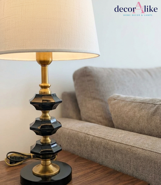 Black crystal table lamp with gold stem and white linen shade on wooden side table — modern bedside lamp Pakistan