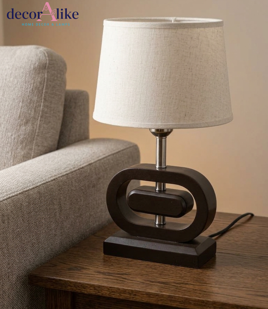 Wooden table lamp with sculptural oval base and beige linen shade — modern bedside lamp Pakistan