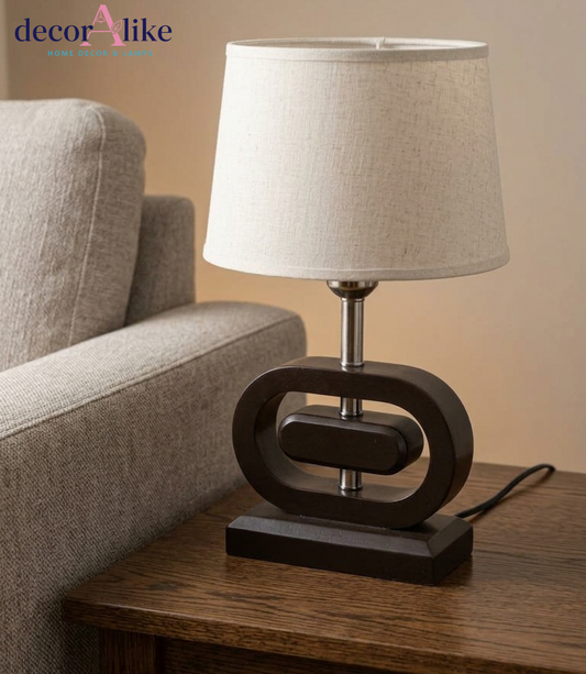 Wooden table lamp with sculptural oval base and beige linen shade — modern bedside lamp Pakistan