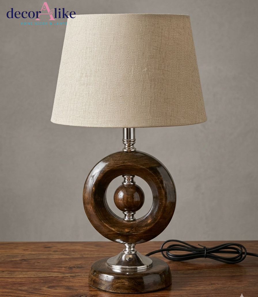 Wooden ring table lamp with centre sphere, chrome fittings and beige linen shade — sculptural bedside lamp Pakistan