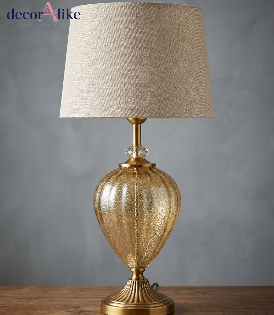 Antique gold mercury glass table lamp with fluted brass-finish base, crystal accent and beige linen drum shade