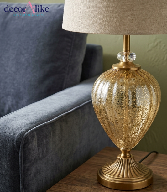 Antique gold mercury glass table lamp with fluted brass-finish base, crystal accent and beige linen drum shade