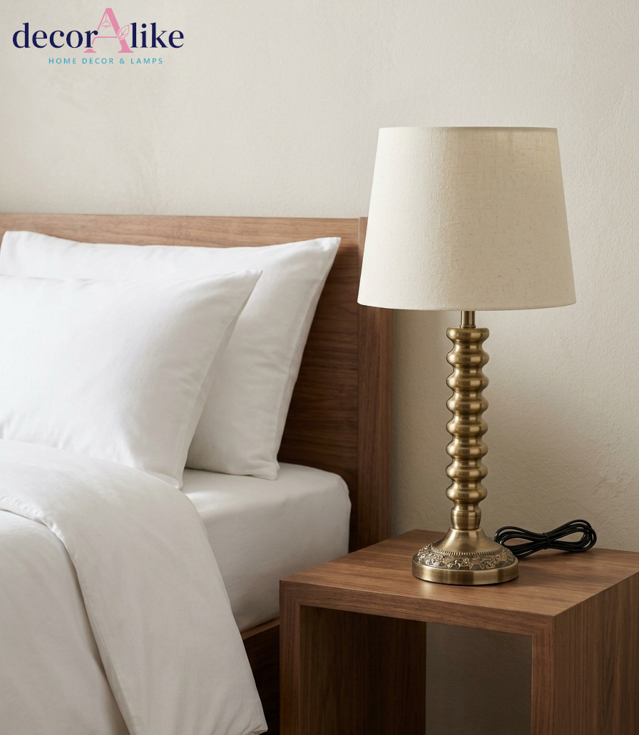 Ribbed antique brass table lamp with cream linen shade on wooden side table — Decoralike Pakistan