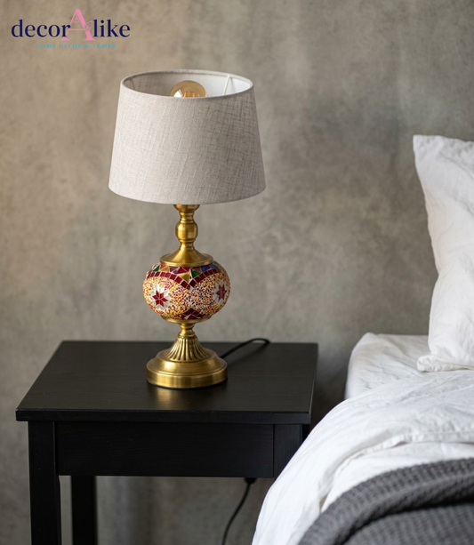 DecorAlike colorful mosaic table lamp showing brass stem, geometric mosaic globe and light gray linen shade