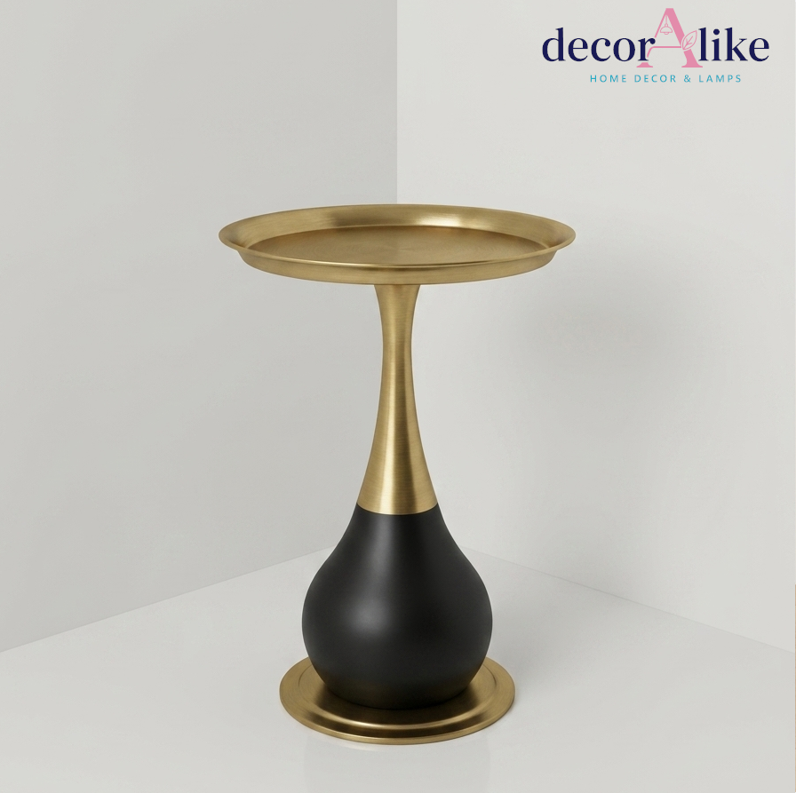 Sculptural round side table with brass stem and matte black base – Decoralike Lahore