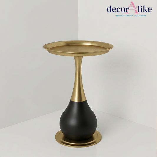Sculptural round side table with brass stem and matte black base – Decoralike Lahore