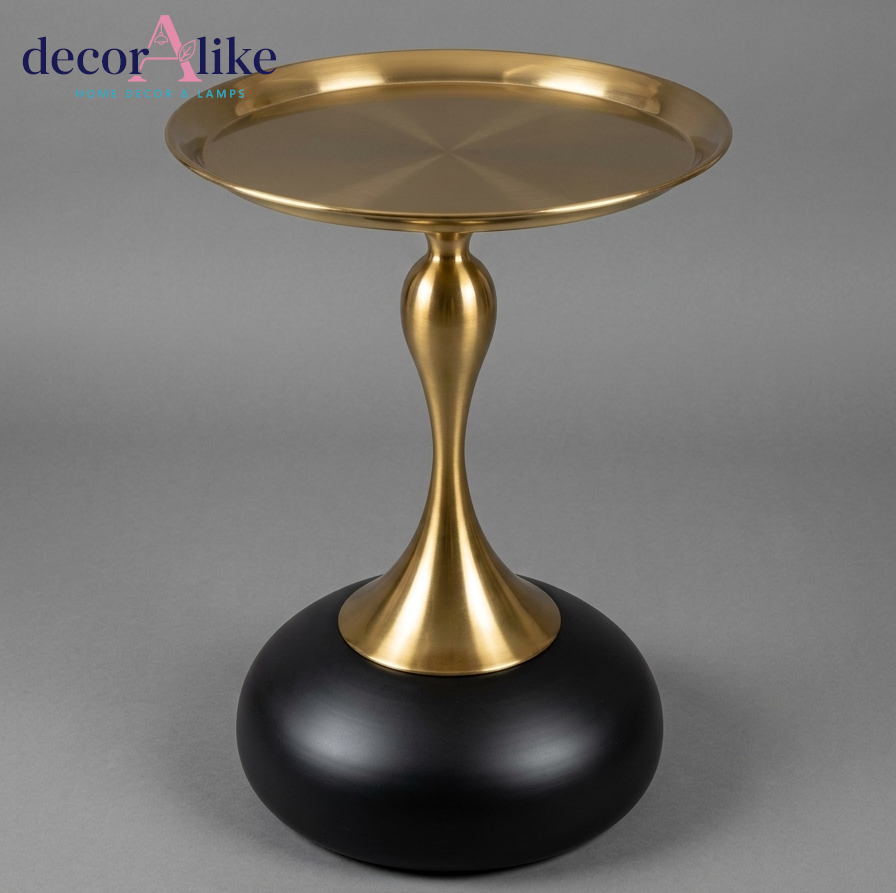 Gold pedestal side table with matte black round base - sculptural accent furniture Pakistan