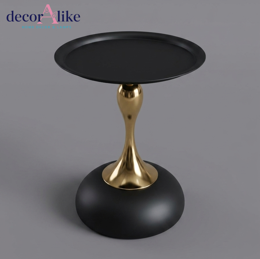 Gold pedestal side table with matte black round base - sculptural accent furniture Pakistan